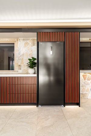 Custom outdoor kitchen with Spotted Gum AliBattens cabinetry and 60mm Corian Whisper benchtops