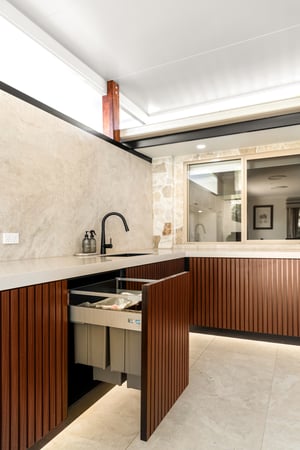 Custom outdoor kitchen with Spotted Gum AliBattens cabinetry and 60mm Corian Whisper benchtops