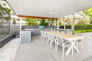 Outdoor kitchen with Heritage Grey cabinetry and Heatlie BBQs