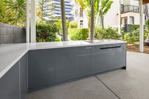 Outdoor kitchen with Heritage Grey cabinetry and Heatlie BBQs