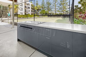 Outdoor kitchen with Heritage Grey cabinetry and Heatlie BBQs