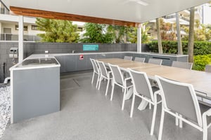 Outdoor kitchen with Heritage Grey cabinetry and Heatlie BBQs