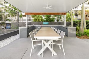 Outdoor kitchen with Heritage Grey cabinetry and Heatlie BBQs