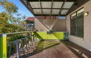 Weber-Q3600-Dulux-Rainforest-Glow-Corian-Concrete-and-Clam-Shell-Alfresco-Kitchen-4-600x380-1